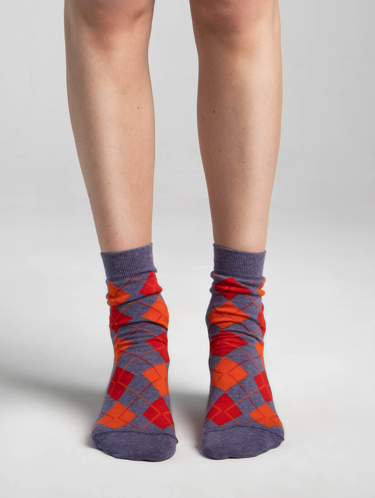 AYDO KRAKOW ORIGIN socks in Ember Clash worn on the foot, leg visible to just below the knee