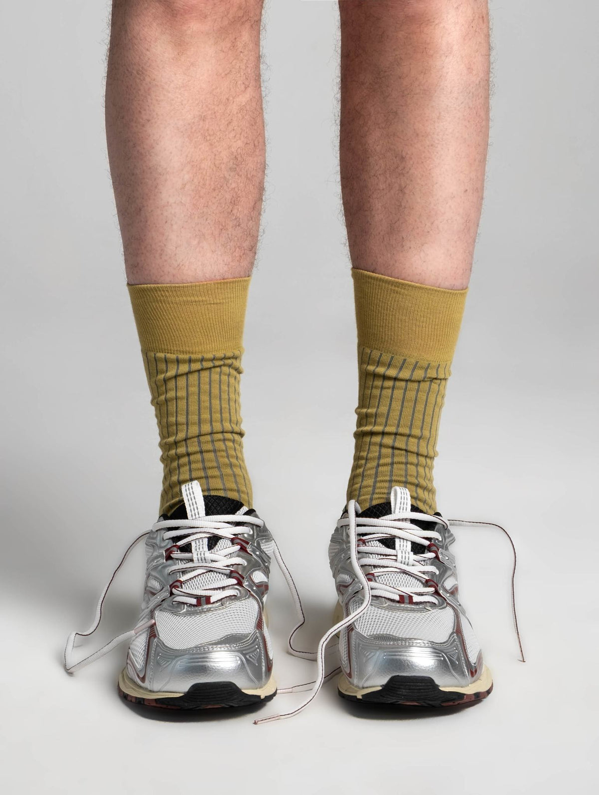 AYDO LUBLIN RHYTHM socks in Rust Pulse worn on the foot, leg visible to just below the knee